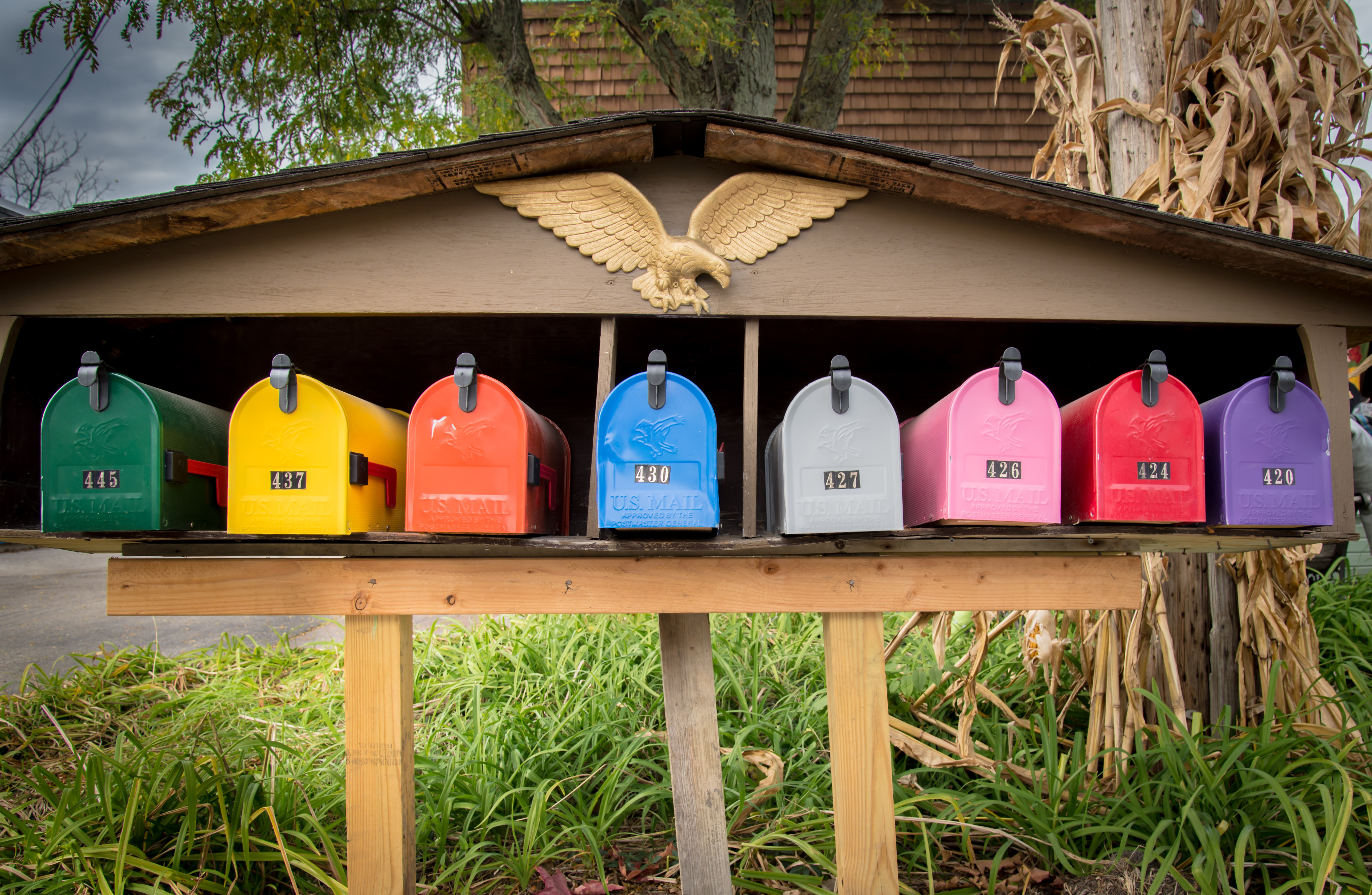 A line of colorful mailboxes.''